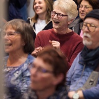 Amused, cheerful audience in the audio world of the 2025 Leipzig Book Fair
