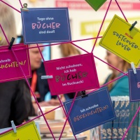 Various colorful postcards from the Leipzig Book Fair 2025